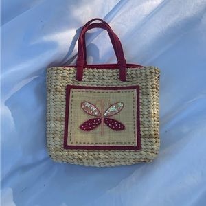 Vintage wicker bag with beaded butterfly